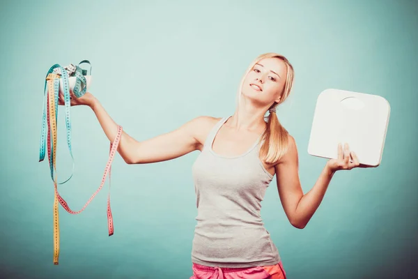 Girl with scales measuring tapes. Weight loss. — Stock Photo, Image