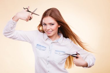 Female barber with trimmers scissors. clipart