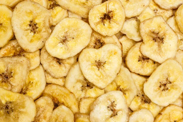 Banán chipszek háttér — Stock Fotó