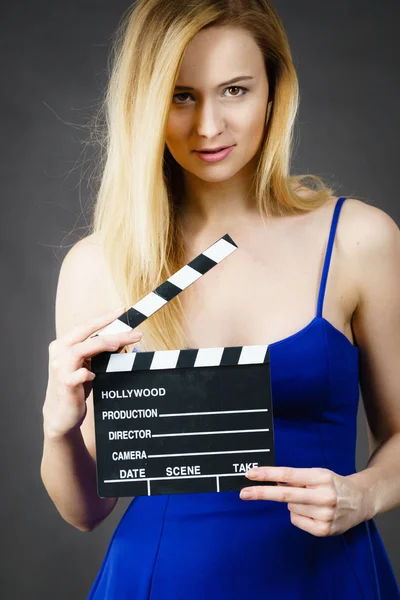 Woman holding professional film slate — Stock Photo, Image