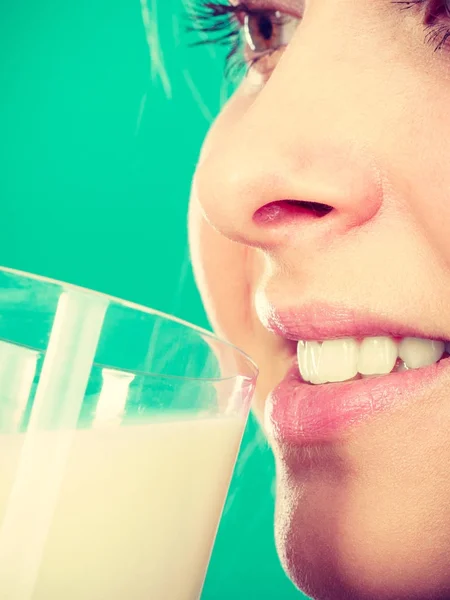 Woman drinking milk from glass