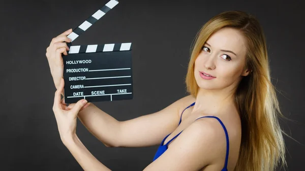 Woman holding professional film slate — Stock Photo, Image