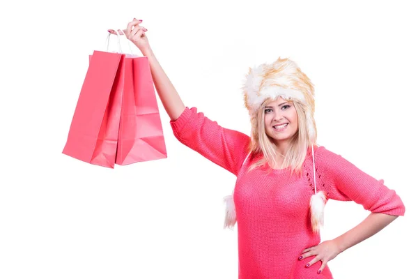 Woman in furry winter hat holding shopping bags — Stock Photo, Image