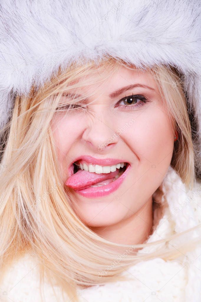 Blonde woman in winter warm furry hat