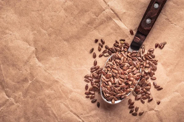 Flax seeds linseed on kitchen spoon — Stock Photo, Image