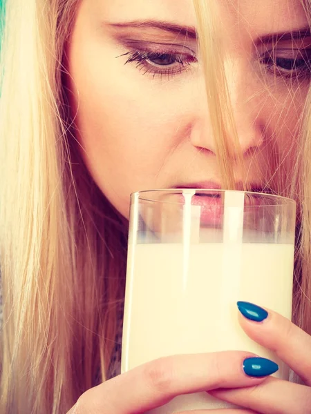 Woman drinking milk from glass