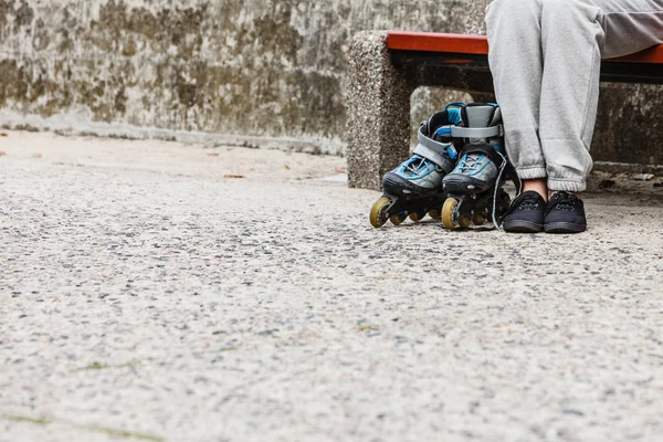 Woman with roller skates outdoor.