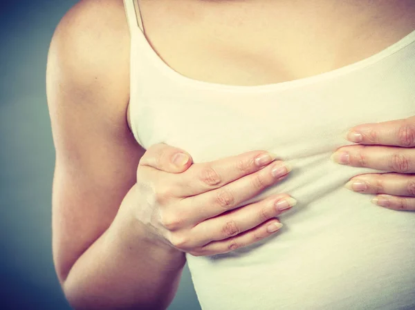Woman holding hands on her breast — Stock Photo, Image