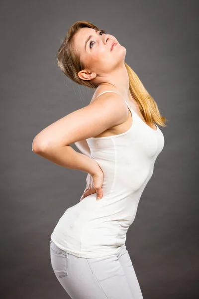 Woman suffering from back pain — Stock Photo, Image