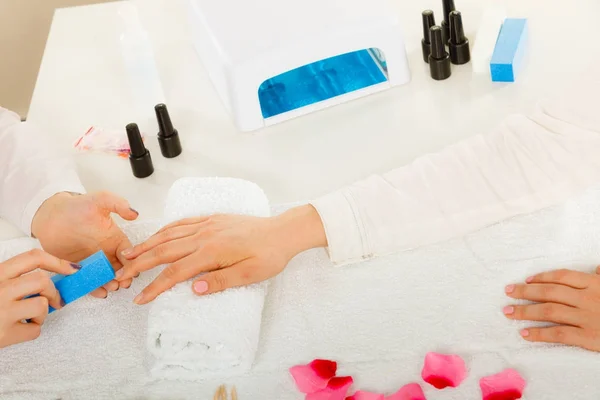 Woman getting manicure done file nails — Stock Photo, Image