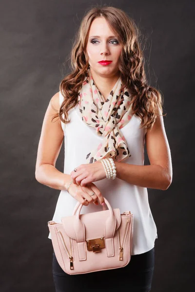 Fashionable girl holding bag handbag. Stock Photo