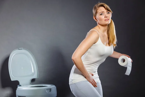 Woman with hands holding her crotch in toilet — Stock Image Woman with hands holding her crotch in toilet Royalty Free Stock Images