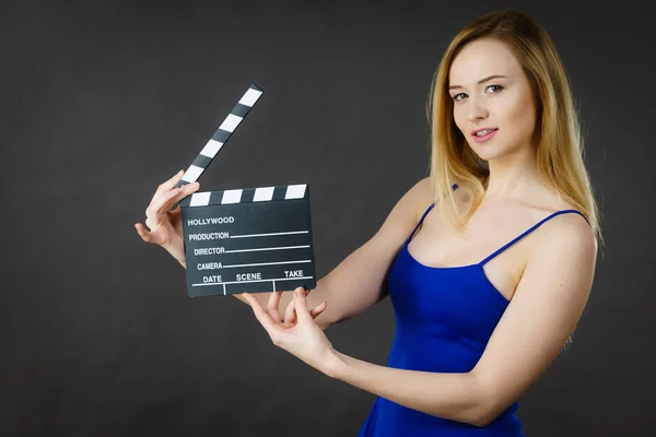 Woman holding professional film slate — Stock Photo, Image