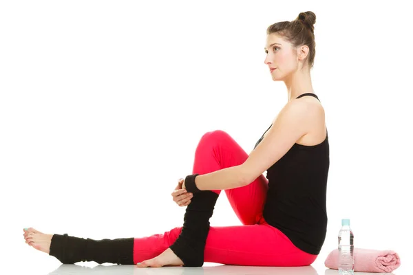 Fit girl stretching isolated on white. — Stock Photo, Image