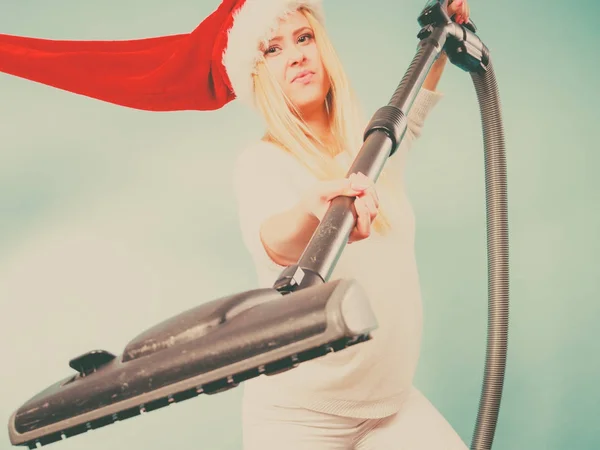 Girl in santa helper hat with vacuum cleaner — Stock Photo, Image