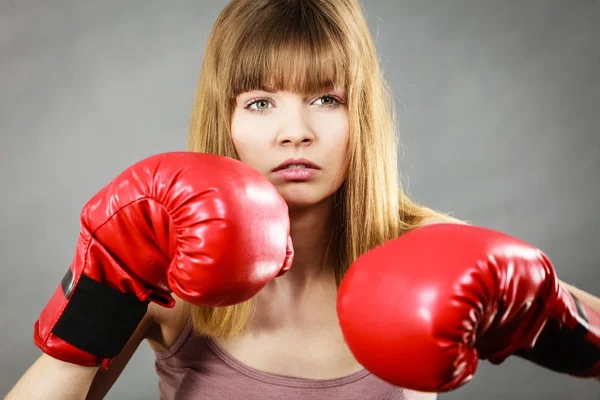 Woman wearing boxing gloves — Stock Photo, Image