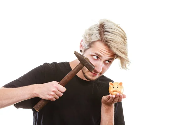Man about to break piggy bank with hammer — Stock Photo, Image