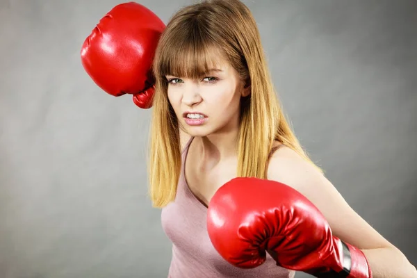 Woman wearing boxing gloves — Stock Photo, Image