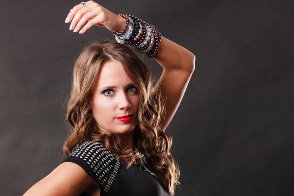 Woman with jewellery in black evening dress — Stock Photo, Image