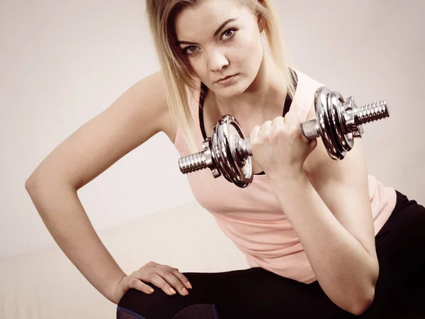 Woman working out at home with dumbbell — Stock Photo, Image