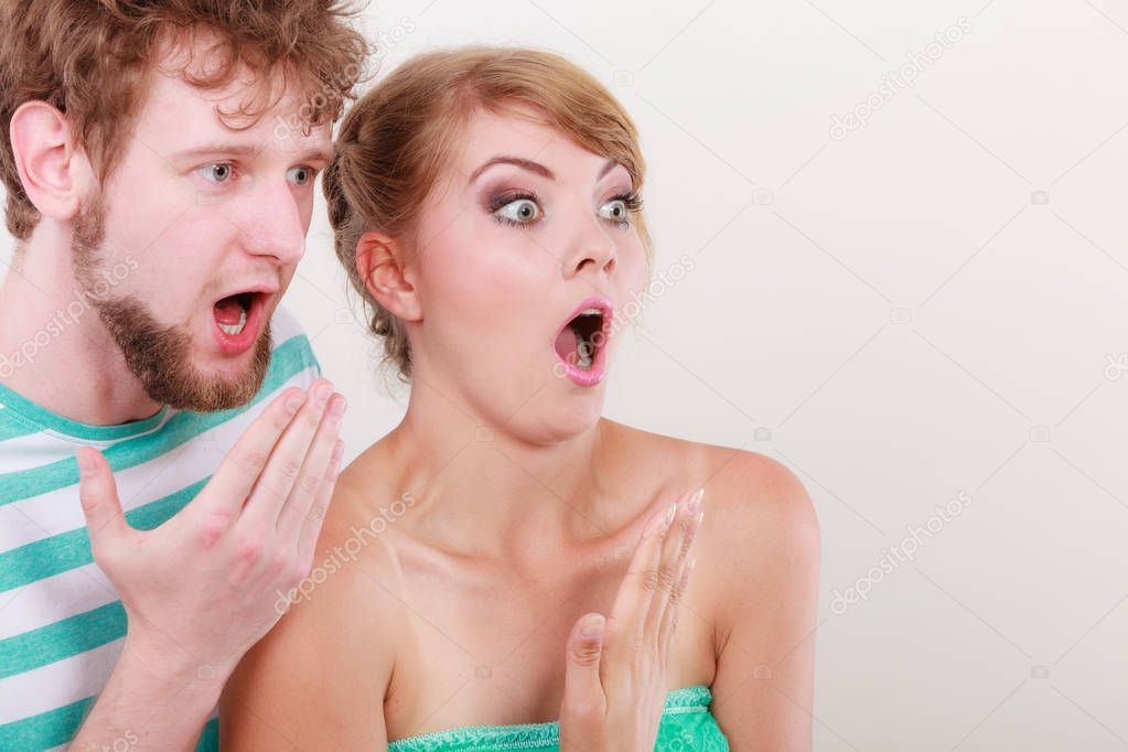  wide eyed couple surprised expression open mouth