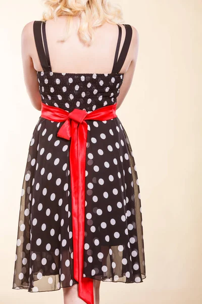 Retro dotted dress with red bow — Stock Photo, Image