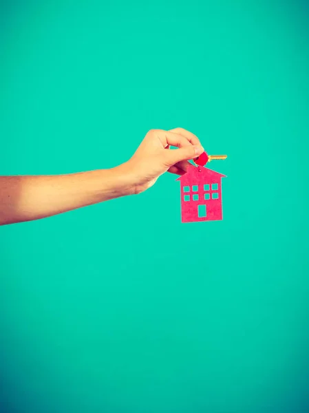 Person holding keys with pendant in house shape — Stock Photo, Image