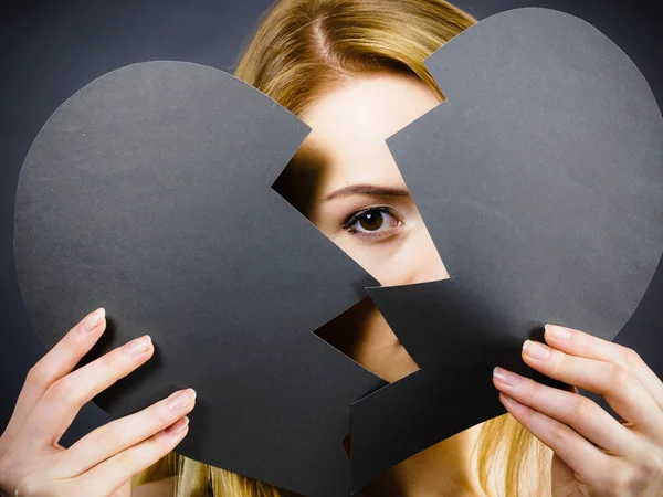 Young sad woman covered by broken heart. — Stock Photo, Image