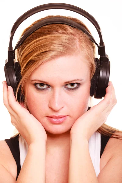 Portrait woman listening to music on headphones — Stock Photo, Image
