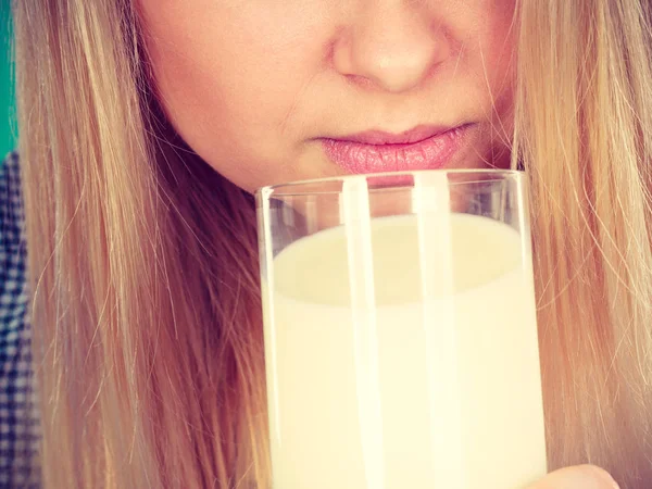 Woman drinking milk from glass