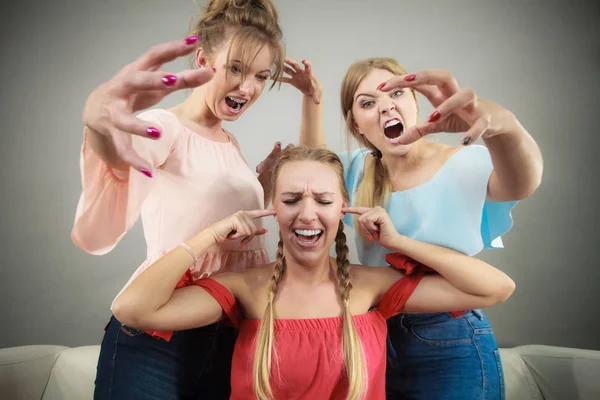 Woman being bullied by two females — Stock Photo, Image