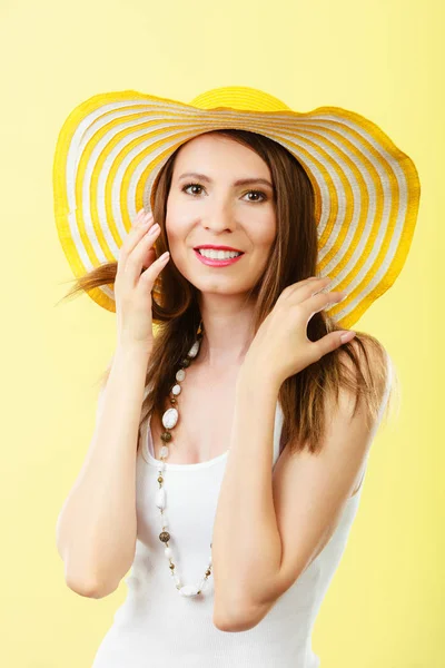 Woman in big yellow summer hat. — Stock Photo, Image