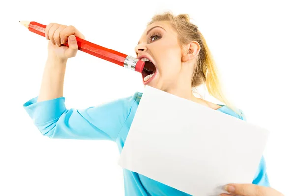 Funny woman biting big pencil — Stock Photo, Image