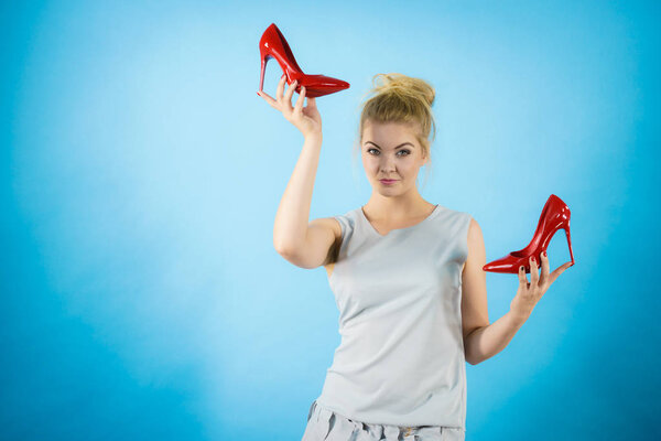 Fashion stylist presenting high heels