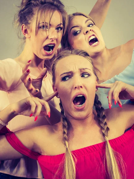 Woman being bullied by two females — Stock Photo, Image