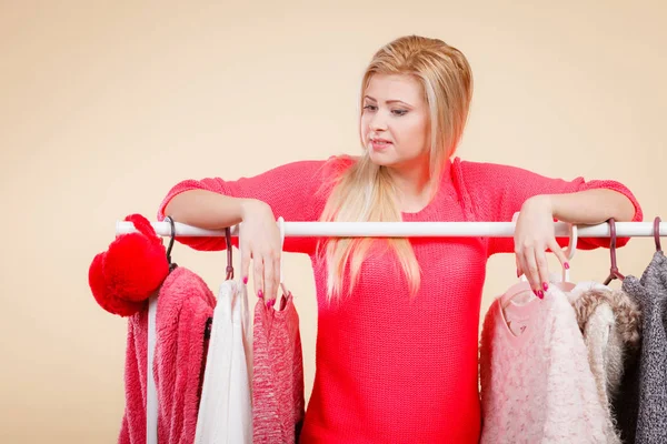 Woman standing in wardrobe picking winter outfit — Stock Photo, Image