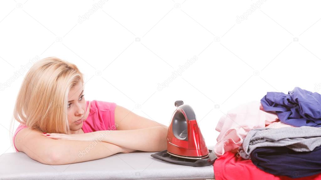 Bored woman holding about to do ironing