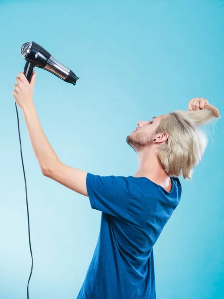 Trendy man with hair dryer — Stock Photo, Image