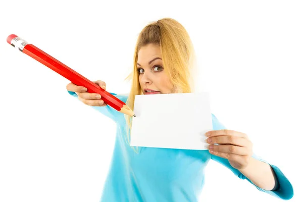 Woman with big pencil writing on paper — Stock Photo, Image