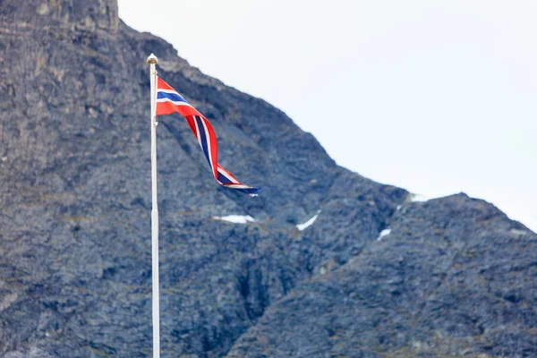Norwegian flag in rocky mountains — Stock Photo, Image