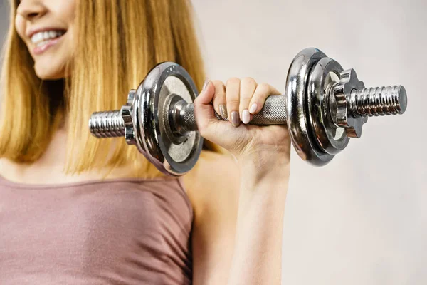 Woman working out at home with dumbbell — Stock Photo, Image