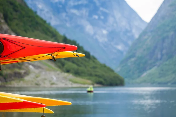 Many canoes on norwegian fjord shore — Stock Photo, Image