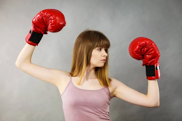 Woman wearing boxing gloves — Stock Photo, Image