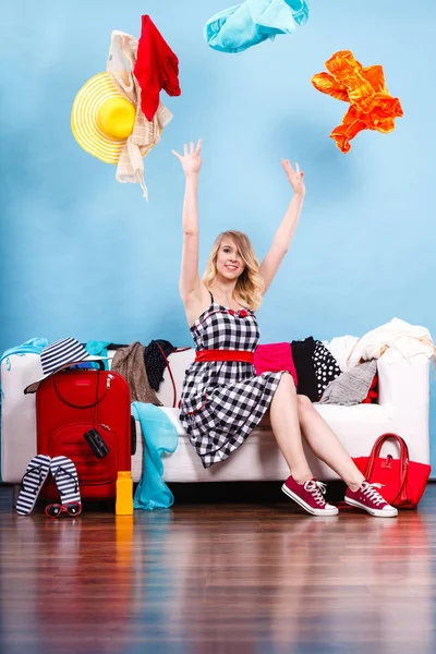 Woman throwing up clothes, clothing flying everywhere — Stock Photo, Image