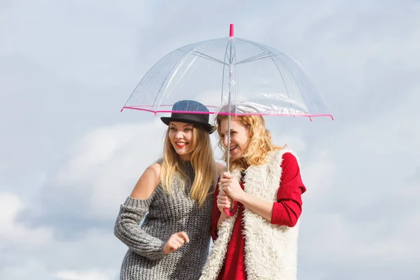 Two fashionable women and umbrella — Stock Photo, Image