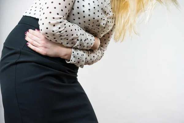 Woman feeling stomach cramps holding her belly — Stock Photo, Image