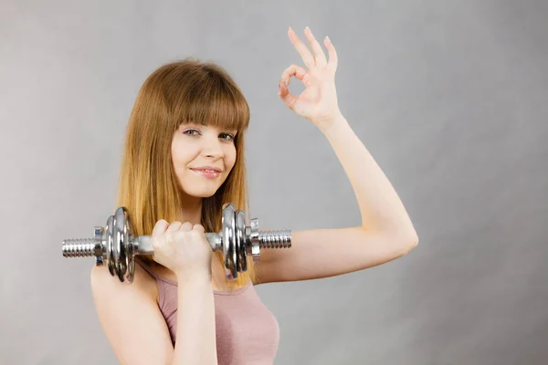Woman working out at home with dumbbell — Stock Photo, Image