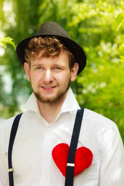 Young man retro style with red heart on chest — Stock Photo, Image