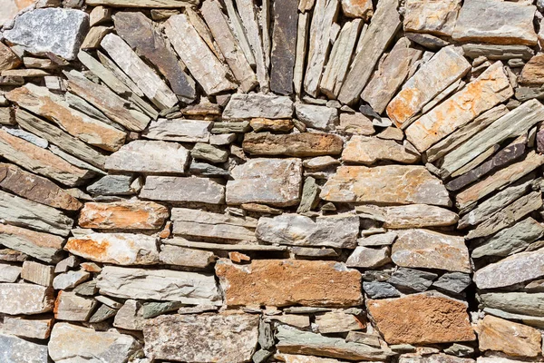 Parede feita de tijolos de pedra . — Fotografia de Stock