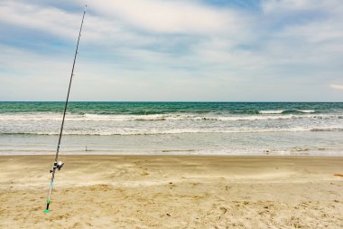 Fishing rod at the shore of sea.